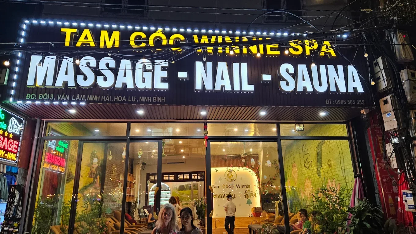 Illuminated Tam Coc Winnie Spa exterior sign at night