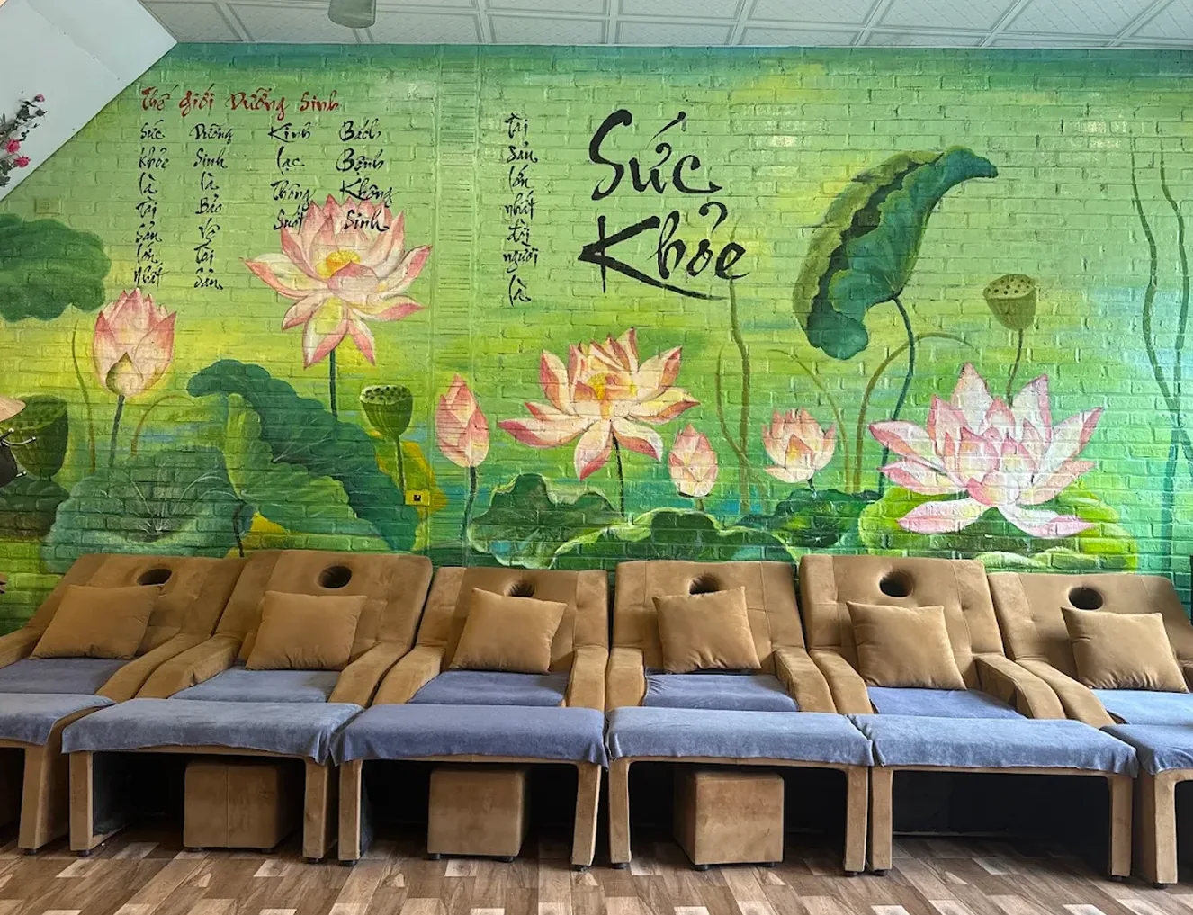 Row of reclining foot massage chairs inside Tam Coc Winnie Spa