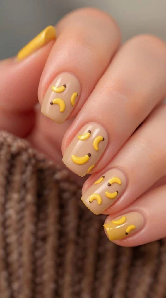 Yellow manicure with fruit design